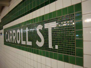 A subway station with a sign that says carroll st.