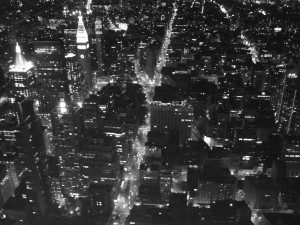 A black and white photo of a city at night.