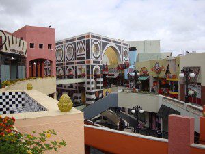 A colorful building in the middle of a street.