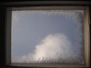 A window with a cloud in it.