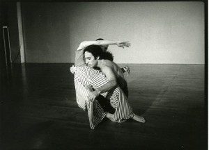 A black and white photo of two people in a room.