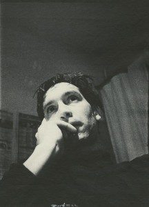 Black and white image of a man thinking something