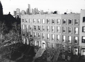 A black and white photo of an apartment building.