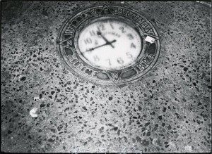 A black and white photograph of a clock.