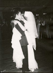 Black and white photo of a bride and groom dancing.