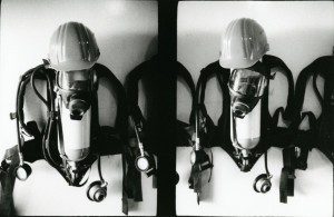 Black and white image of a face masks on wall