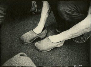 A pair of clogs on the floor.