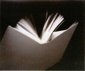 A book with a white cover and a black background.
