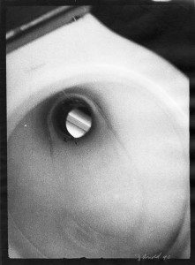 A black and white photograph of a toilet.