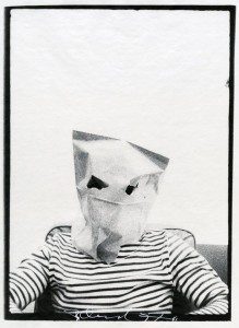 A black and white photo of a man with a paper bag on his head.