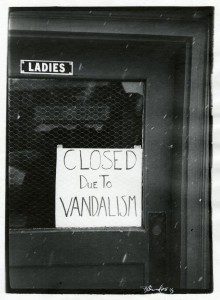 A sign that says closed due to vandalism.