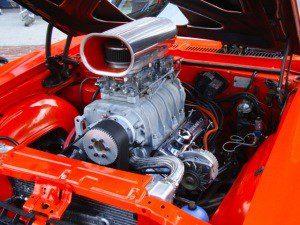 Engine of a car coming out of car in red color