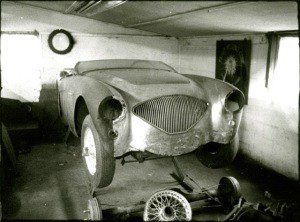 Black and white image of an Austin car in garage